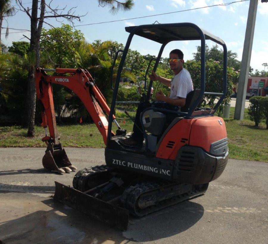 Aztec Plumbing & Drains backhoe