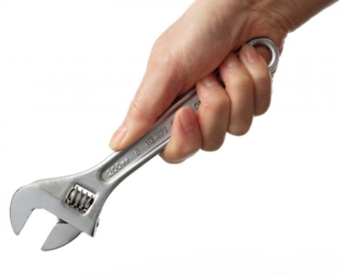 hand holding wrench