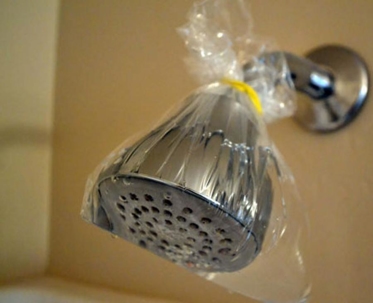 plastic over shower head for cleaning without chemicals