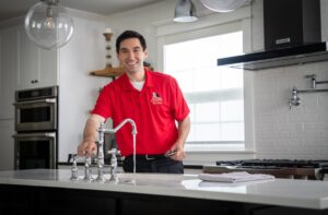 technician working on sink